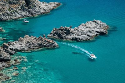 High angle view of boat in calm blue sea