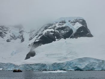 Scenic view of frozen sea against sky