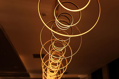 Blurred hanging lamp bulb in the form of rings. blur beautiful abstract lighting under the ceiling