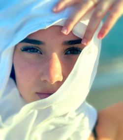 Close-up portrait of young woman wearing mask