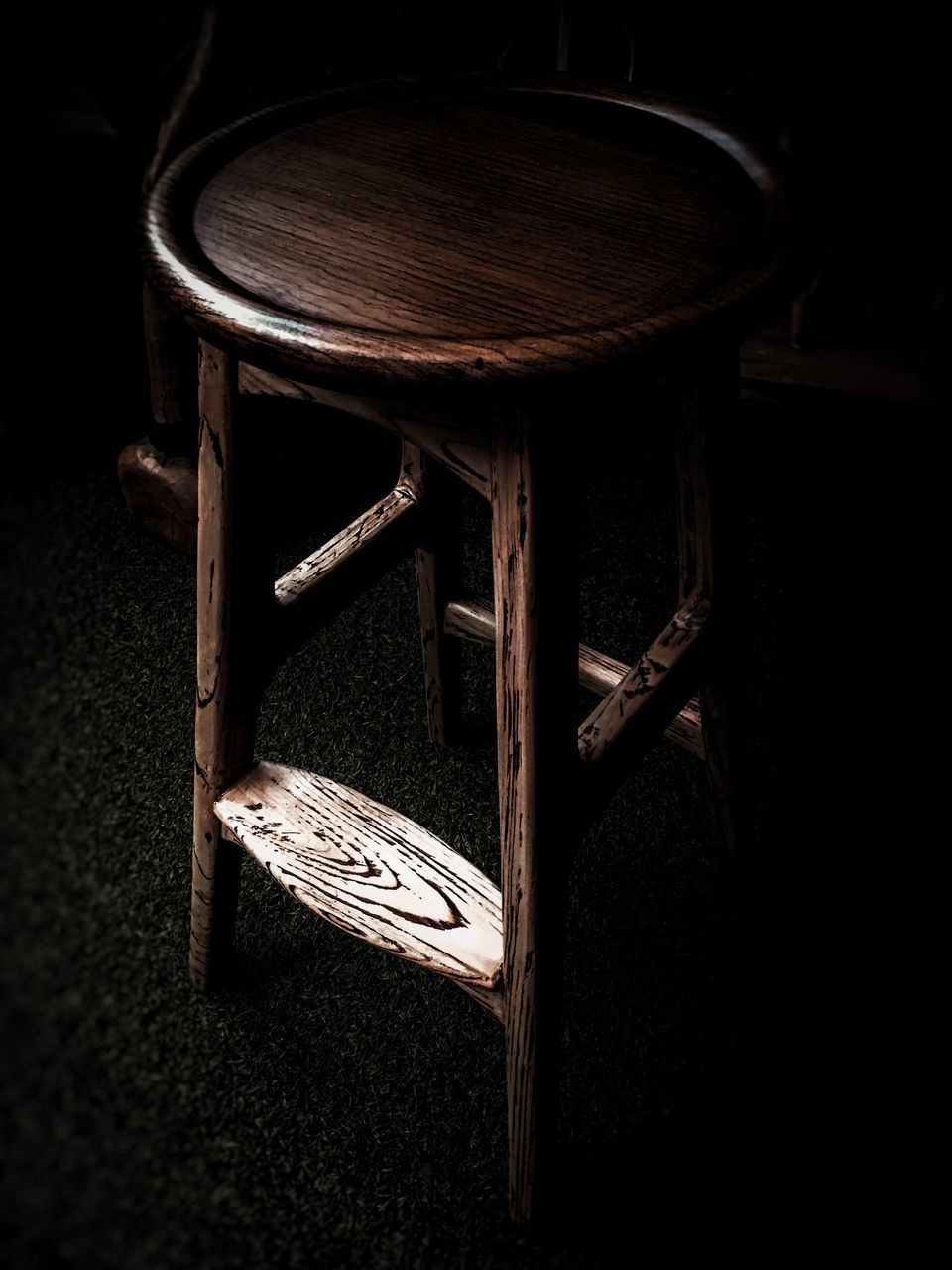 black, furniture, darkness, table, indoors, wood, no people, seat, chair, stool, white, still life, lighting, dark, close-up