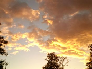 Low angle view of cloudy sky at sunset