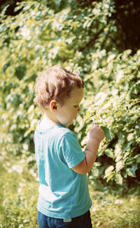 Full length of cute boy standing on land