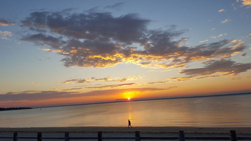 Scenic view of sunset over calm sea