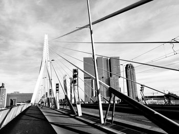 View of suspension bridge against cloudy sky