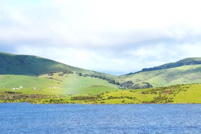 Scenic view of mountains against cloudy sky