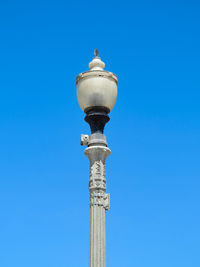 Low angle view of tower against blue sky