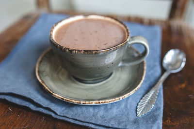 Close-up of coffee cup on table