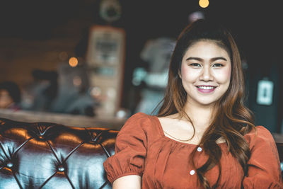 Portrait of smiling young woman