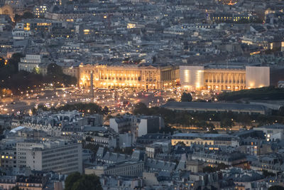 Aerial view of paris at dusk with the city illuminated