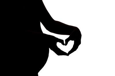 Close-up of silhouette heart shape against white background
