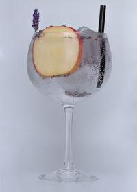 Close-up of wine glass against white background