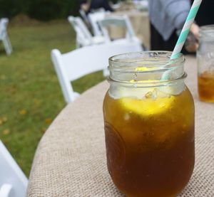 Close-up of ice tea in jar on table