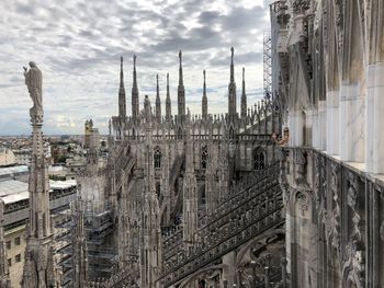 Panoramic view of buildings in city against sky