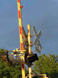 Low angle view of communications tower against sky