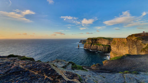 Scenic view of sea against sky during sunset. cliffs of moher, ireland