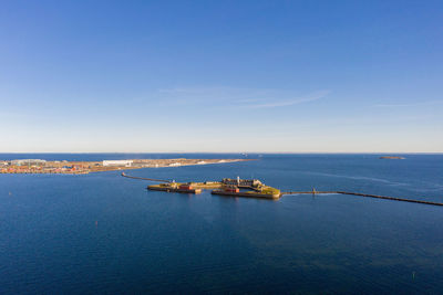 Scenic view of sea against blue sky