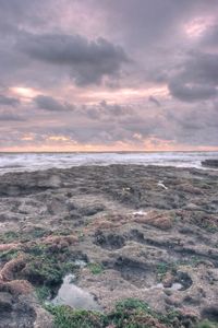 Scenic view of sea against cloudy sky