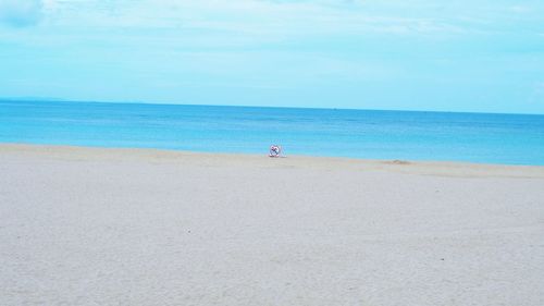 Scenic view of beach and sea against sky