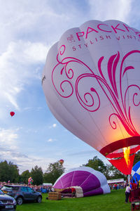 High angle view of pink balloons against sky