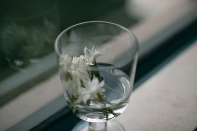 High angle view of glass on white table