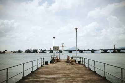 Pier over sea against sky