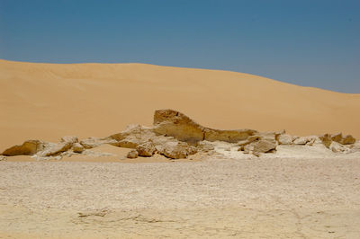 Scenic view of desert against clear sky