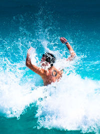 People surfing in sea