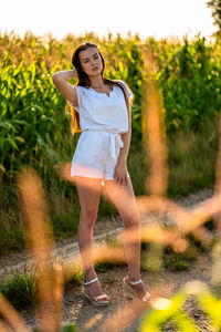 Young woman standing on field