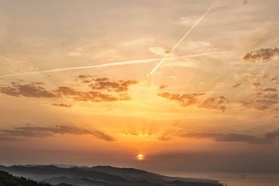 Scenic view of mountains against sky during sunset