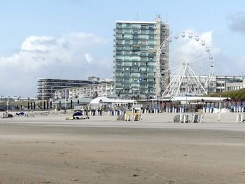 View of ferris wheel in city