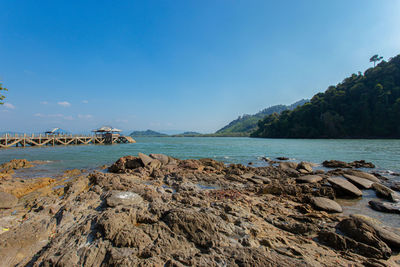 Scenic view of sea against blue sky