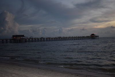 Scenic view of beach against sky during sunset