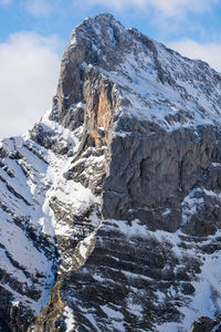 Close-up of snow on mountain against sky