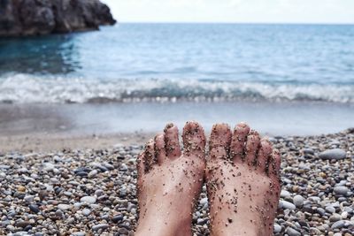 Low section of person on beach