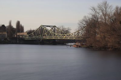 Bridge over river against sky