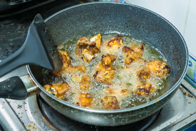 High angle view of meat in frying pan