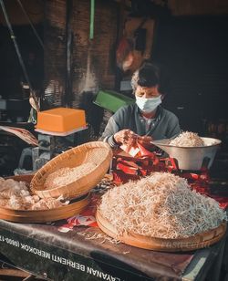 Man holding ice cream on table