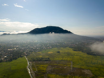 Scenic view of landscape and mountains against sky