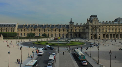 Louvre palace against sky in city