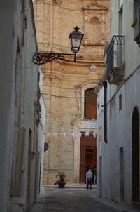 Alley amidst buildings in city