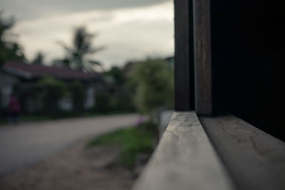 Surface level of road against sky at sunset