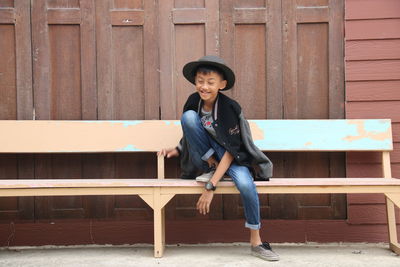Portrait of smiling woman sitting on seat