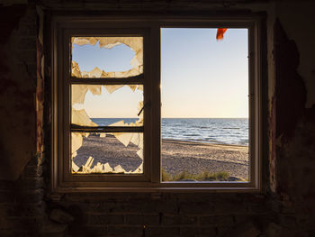 View on sea from abandoned house window