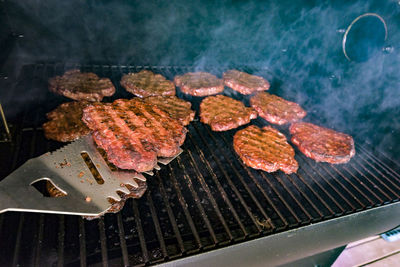 High angle view of meat on barbecue grill