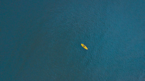 Man kayaking in sea