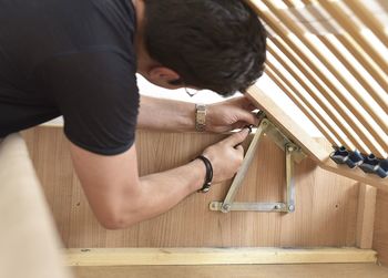 High angle view of man working on wood