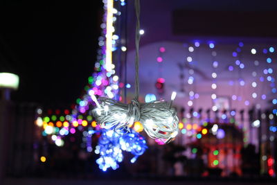 Close-up of illuminated christmas decorations at night