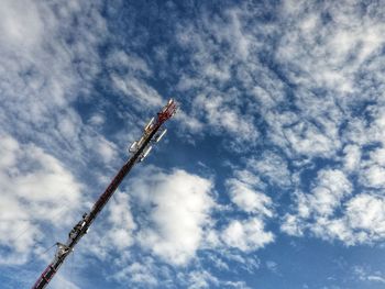 Low angle view of crane against sky