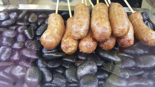 High angle view of meat on barbecue grill